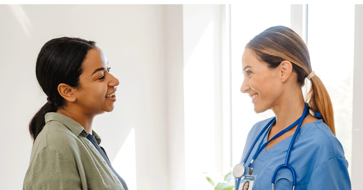 Woman speaking with a medical professional about abortion pill information